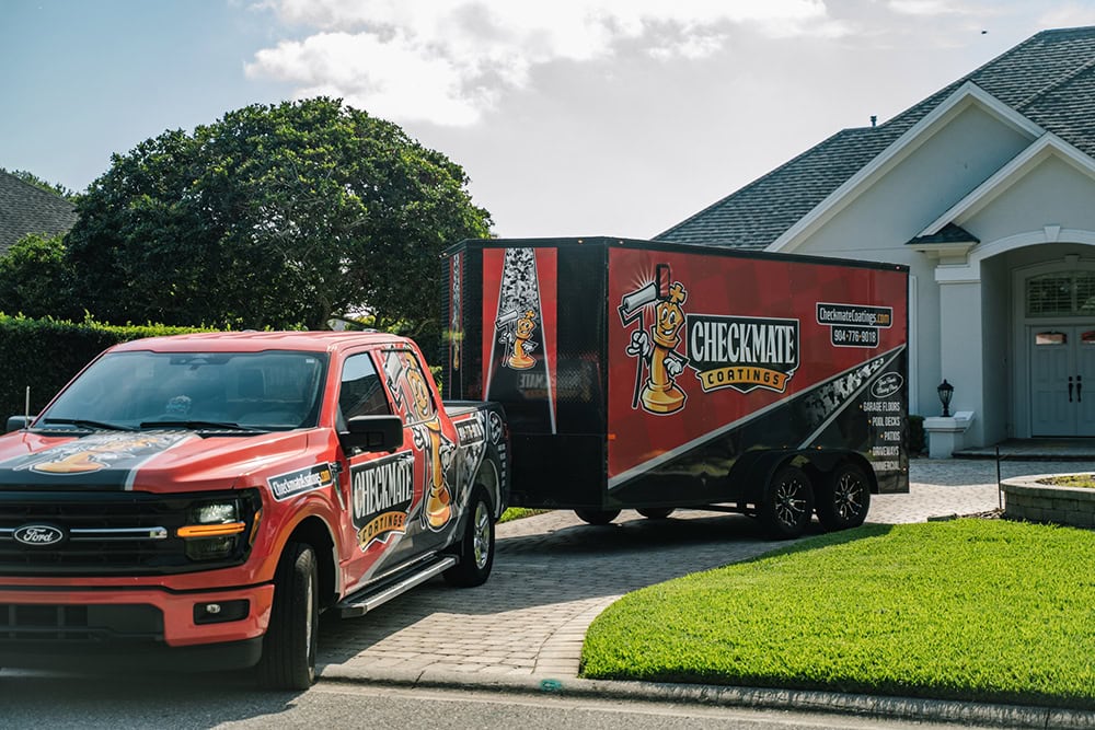 Professional coating service vehicle with Checkmate Coatings branding parked in front of a residential home.