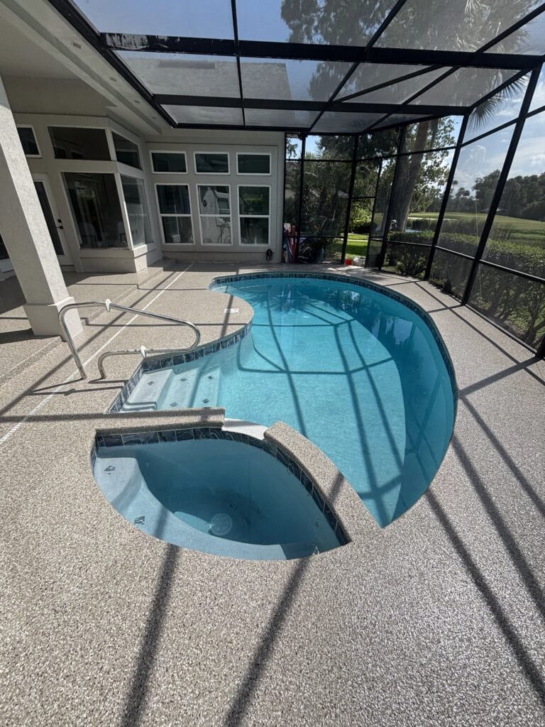 Beautiful screened-in pool and patio with fresh coating, perfect for outdoor relaxation in NEFL/GA.