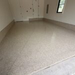 Clean, durable garage floor with a speckled finish in a residential space.